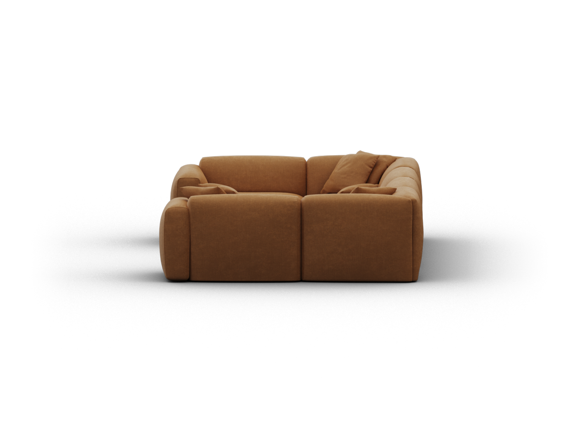 Luxury modular sofa, upholstered in rich caramel suede fabric, with plush cushioning. Sleek lines enhance its modern aesthetic, perfect for elegant living spaces.