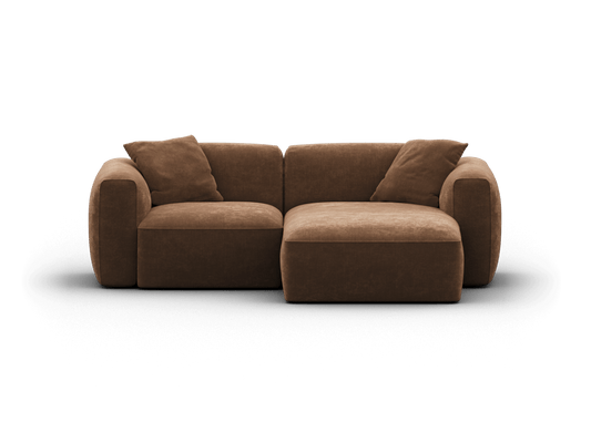 Luxurious brown velvet sofa with a modern, modular design. Features plush cushions and rounded armrests. Ideal for sophisticated living spaces.