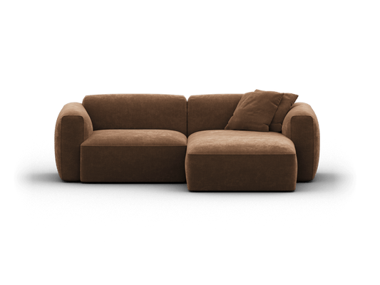Luxurious brown suede sectional sofa with plush cushions, featuring a rounded arm design and chaise lounge. Perfect for a modern living room setting.