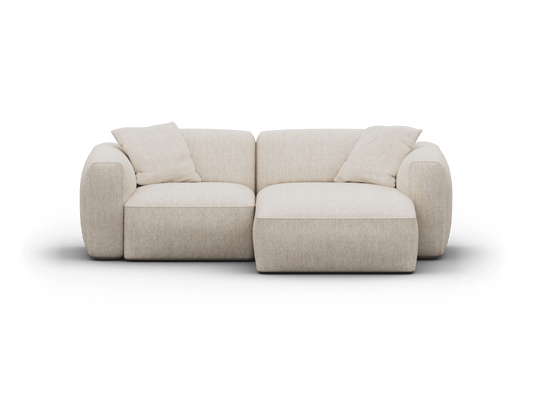 Luxurious cream fabric sofa with plush, rounded armrests and deep seat cushions. Contemporary low-profile design, perfect for an elegant living room.