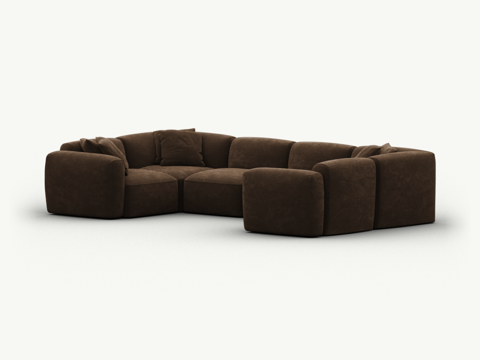 Luxurious dark brown velvet sectional sofa with deep cushions and modular design, creating a sophisticated centrepiece for modern living spaces.