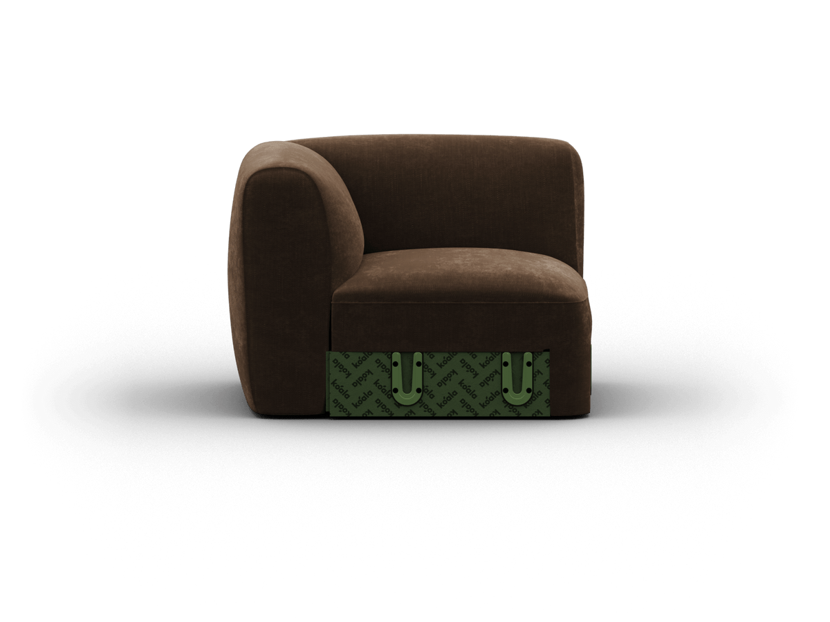 Luxurious brown fabric armchair with a plush curved backrest, accented by a modern green patterned base. Ideal for contemporary living spaces.
