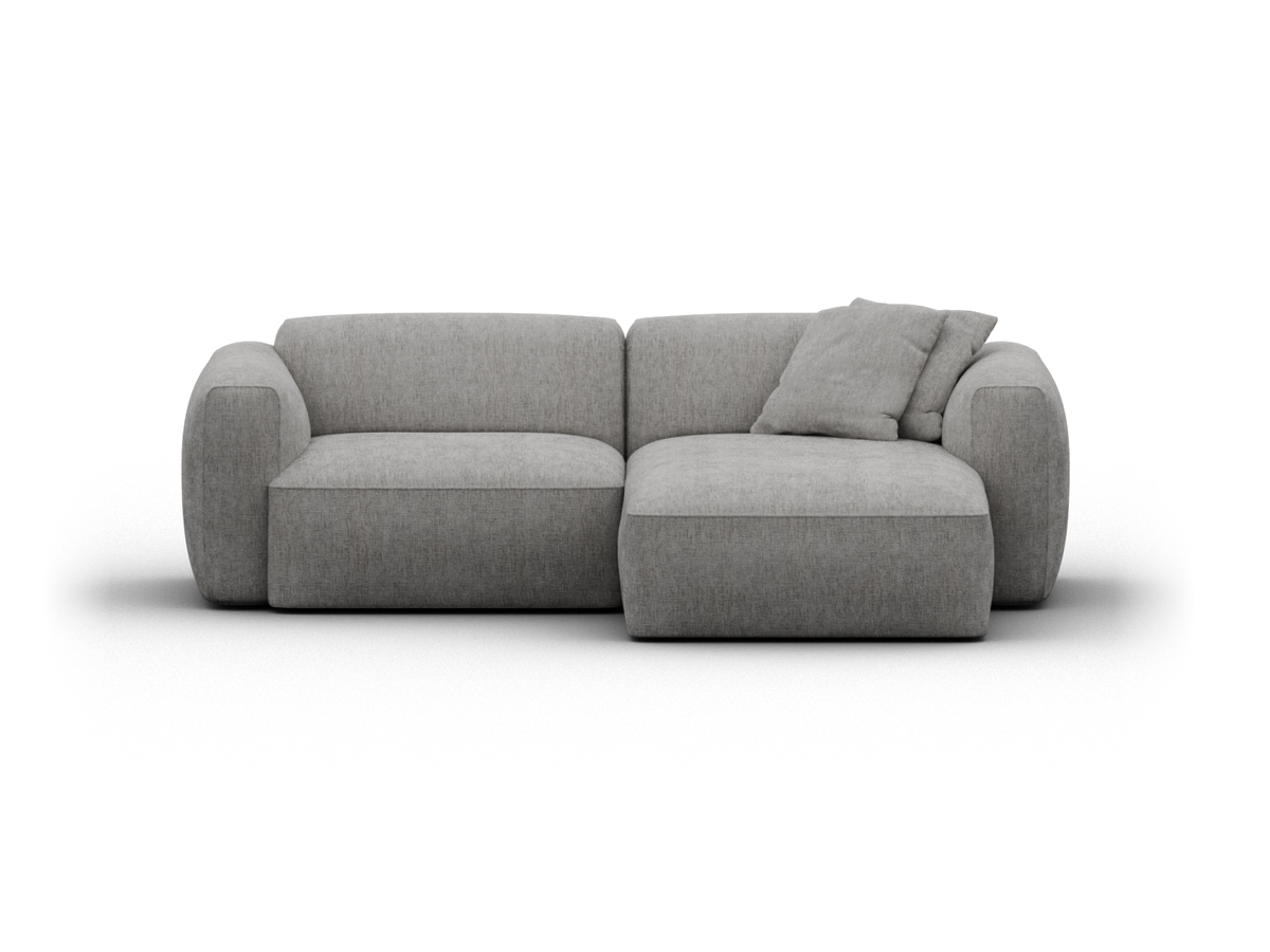 Modern grey fabric sectional sofa with plush cushions, featuring rounded arms and minimalist lines. Perfect for a sophisticated living room ambiance.