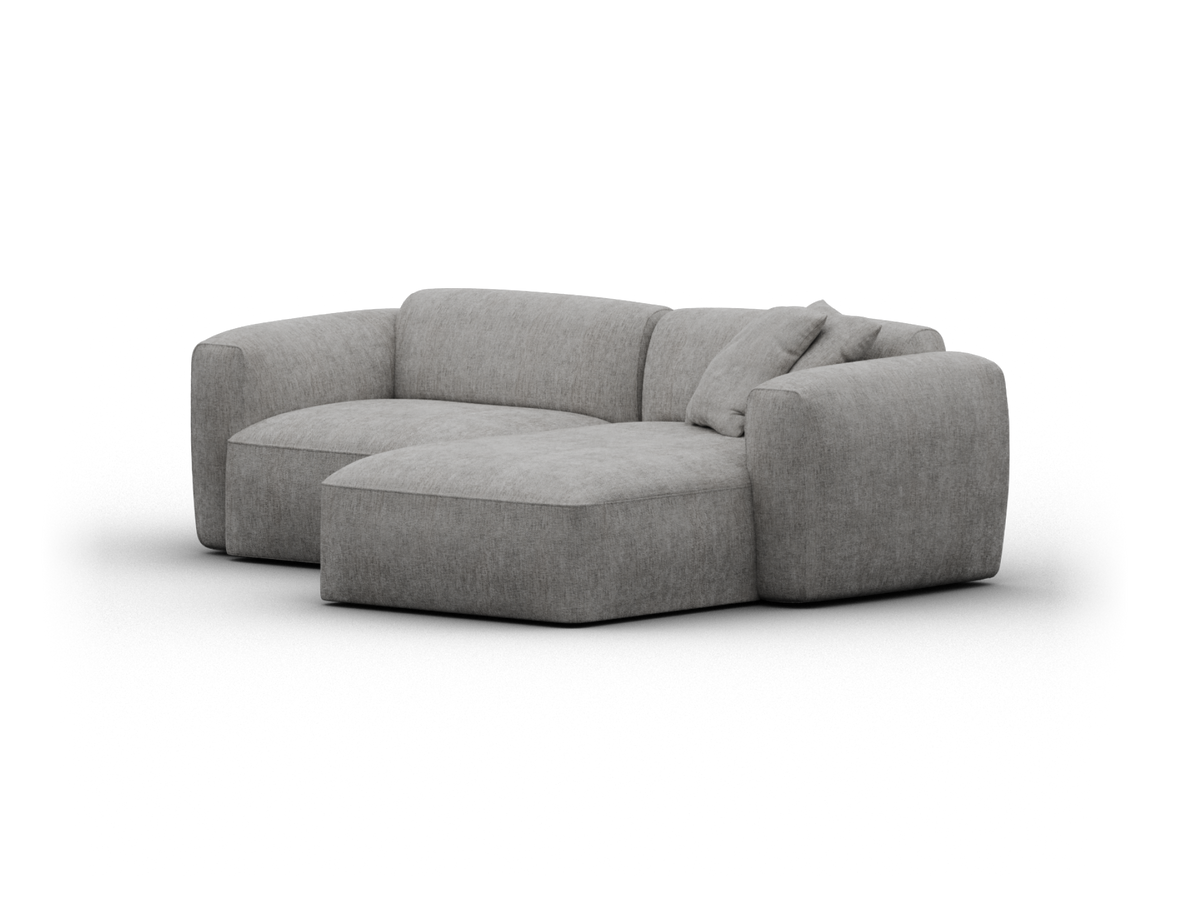Luxurious grey fabric sectional sofa with plush cushioning, featuring a minimalist design. Perfect for a sophisticated living room setting.