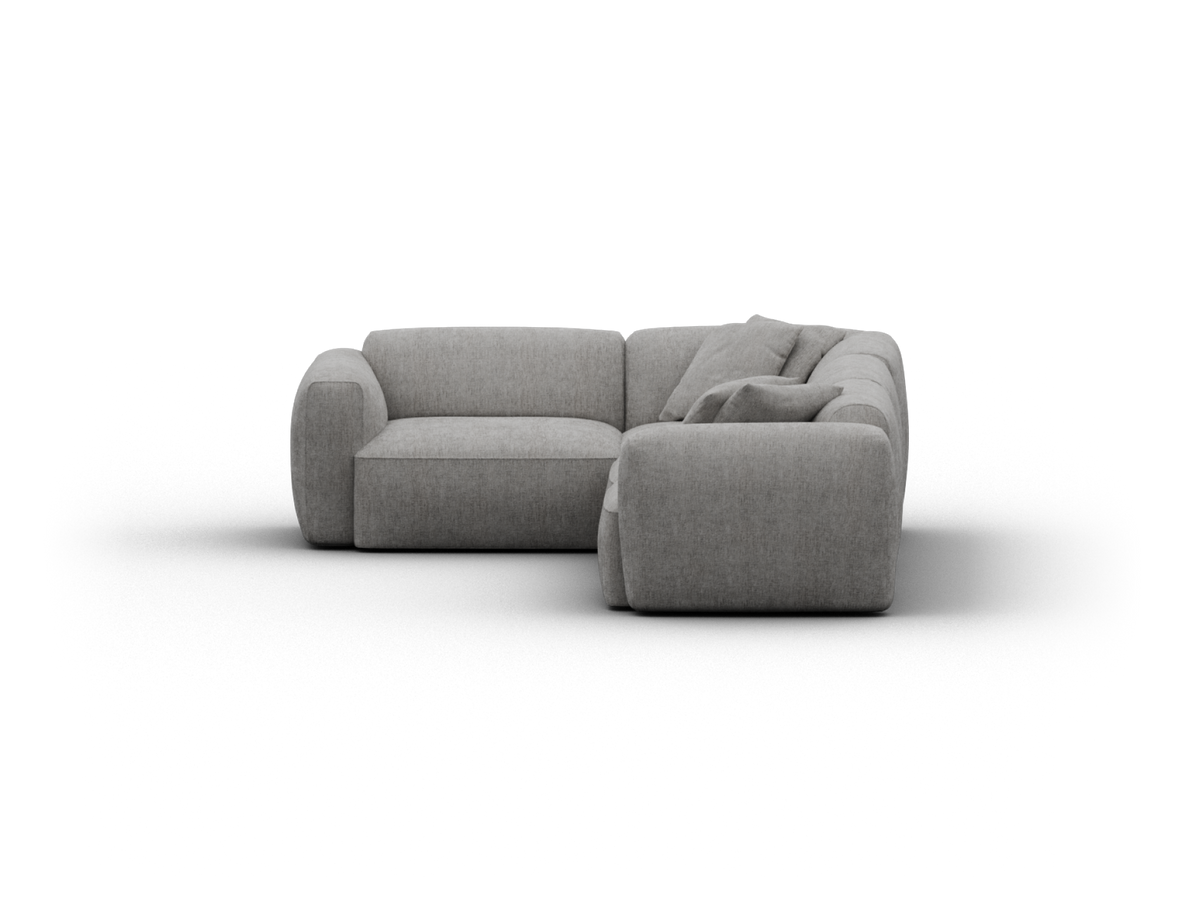 Luxurious grey fabric sectional sofa with plush cushions, contemporary design, and rounded edges. Perfect for a sophisticated living room setting.