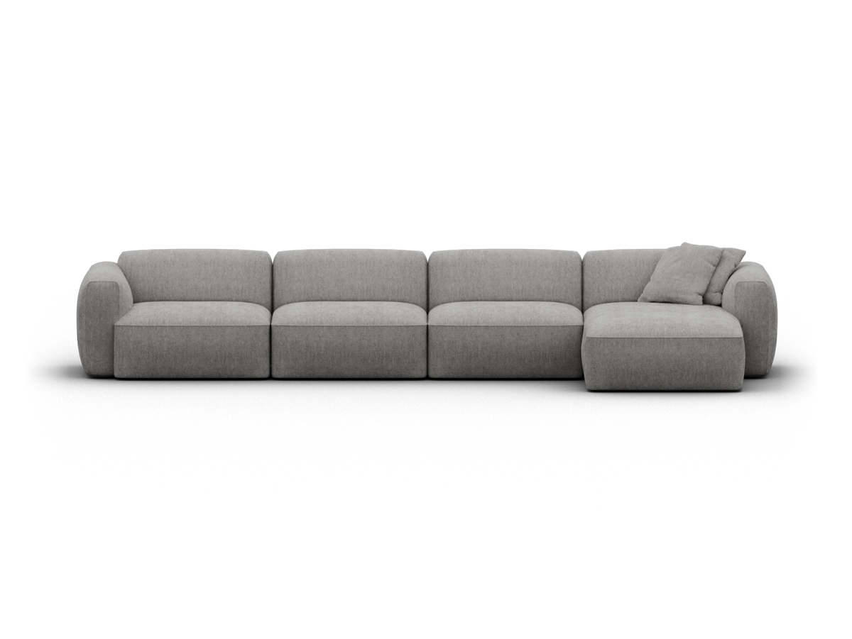 Luxurious grey sectional sofa in soft fabric. Features modular design with chaise end. Sleek, low profile ideal for contemporary living rooms.