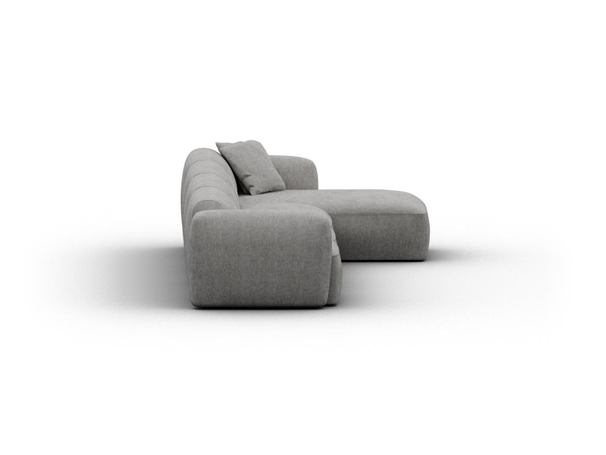 Modern grey fabric sectional sofa featuring plush cushions and a low profile silhouette. Luxurious and minimalist, perfect for sophisticated living spaces.