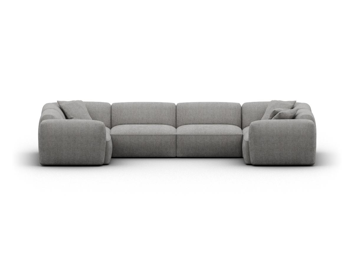 Modular grey fabric sectional sofa; plush padding, low profile design in a modern living room setting. Features a minimalist aesthetic with clean lines.