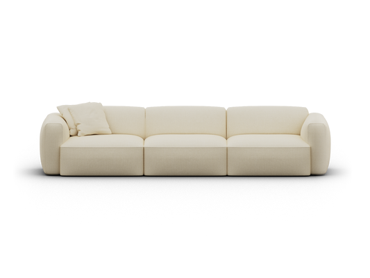 Cream modular sofa in plush upholstery, featuring three deep seats and curved armrests, accompanied by matching cushions. Ideal for luxe living spaces.