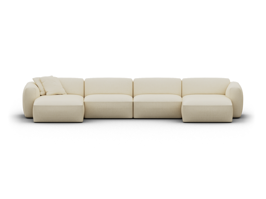 Luxurious cream-coloured modular sofa with plush upholstery, featuring plush armrests and a chaise lounge, in a modern, minimalist setting.