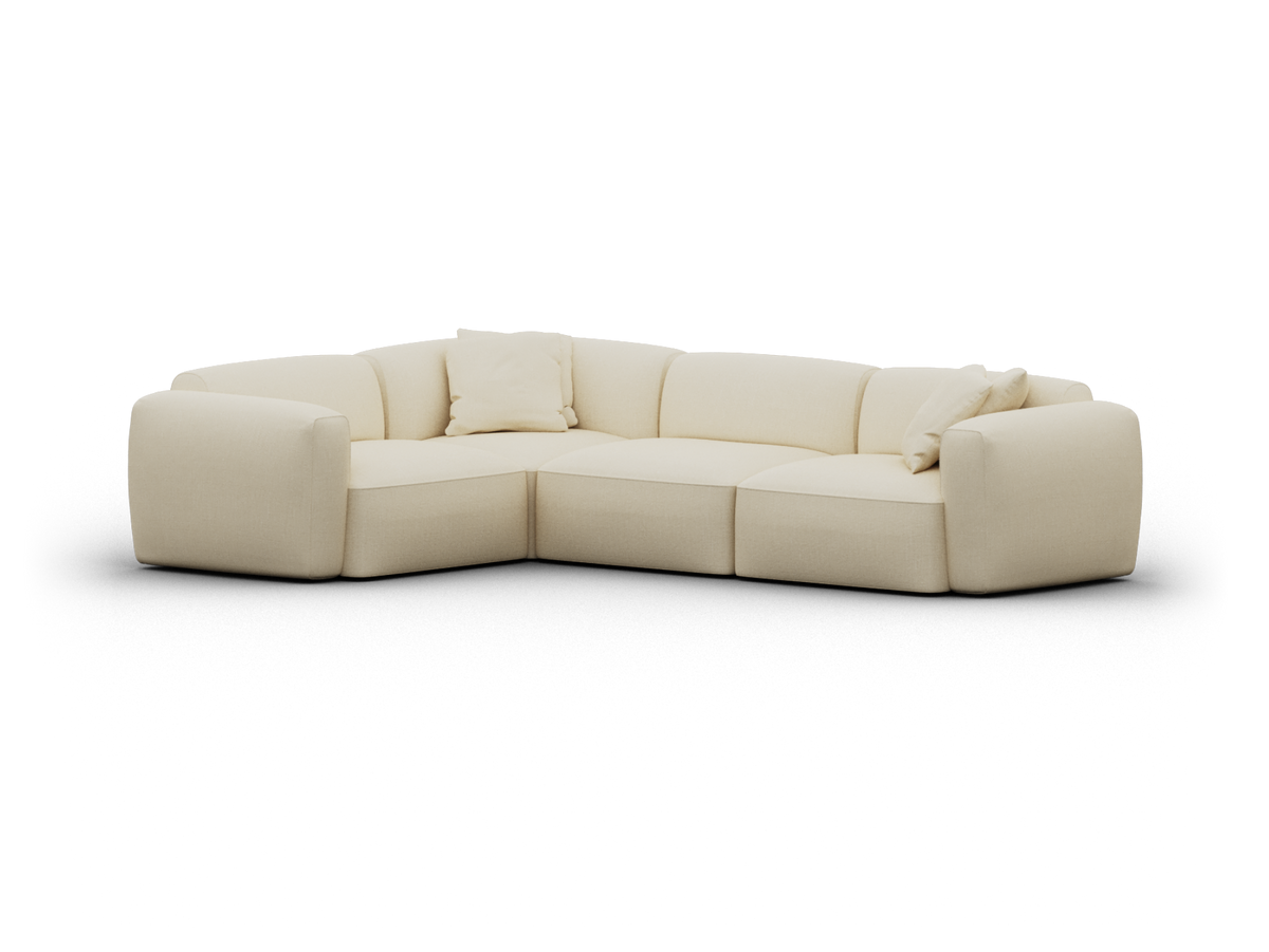 Luxurious cream-coloured sectional sofa, upholstered in soft fabric. Features modular design and plush cushions, perfect for modern living spaces.