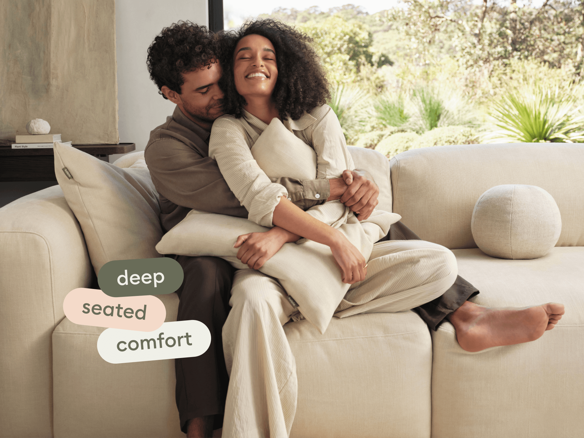 Luxurious cream fabric sofa featuring deep seating, plush cushions, and a sleek, modern design, set in a bright, tranquil living space.