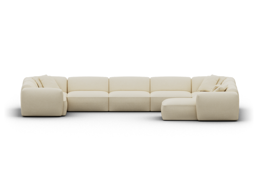 Luxurious beige modular sectional sofa, upholstered in plush fabric with deep seating. Features a contemporary silhouette, ideal for modern living spaces.
