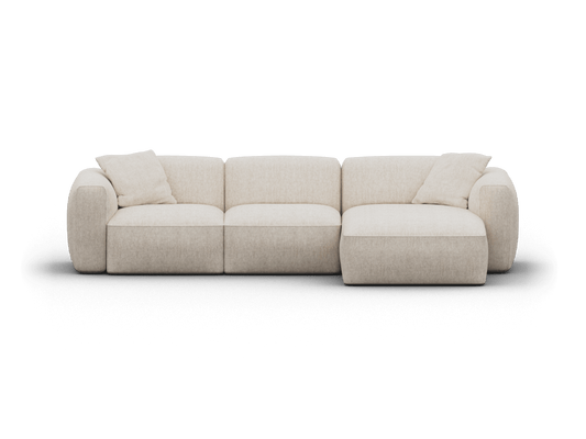 Luxurious beige fabric sectional sofa with plush cushions and sleek lines, set in a contemporary living room for a sophisticated, modern ambience.