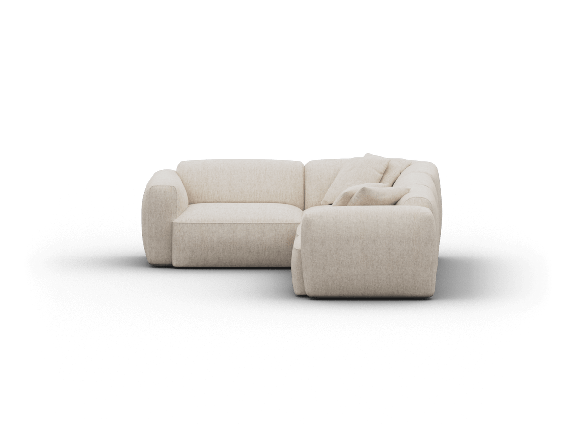 Luxurious beige fabric sectional sofa with plush, rounded cushions. Features a contemporary L-shape design, perfect for elegant living spaces.