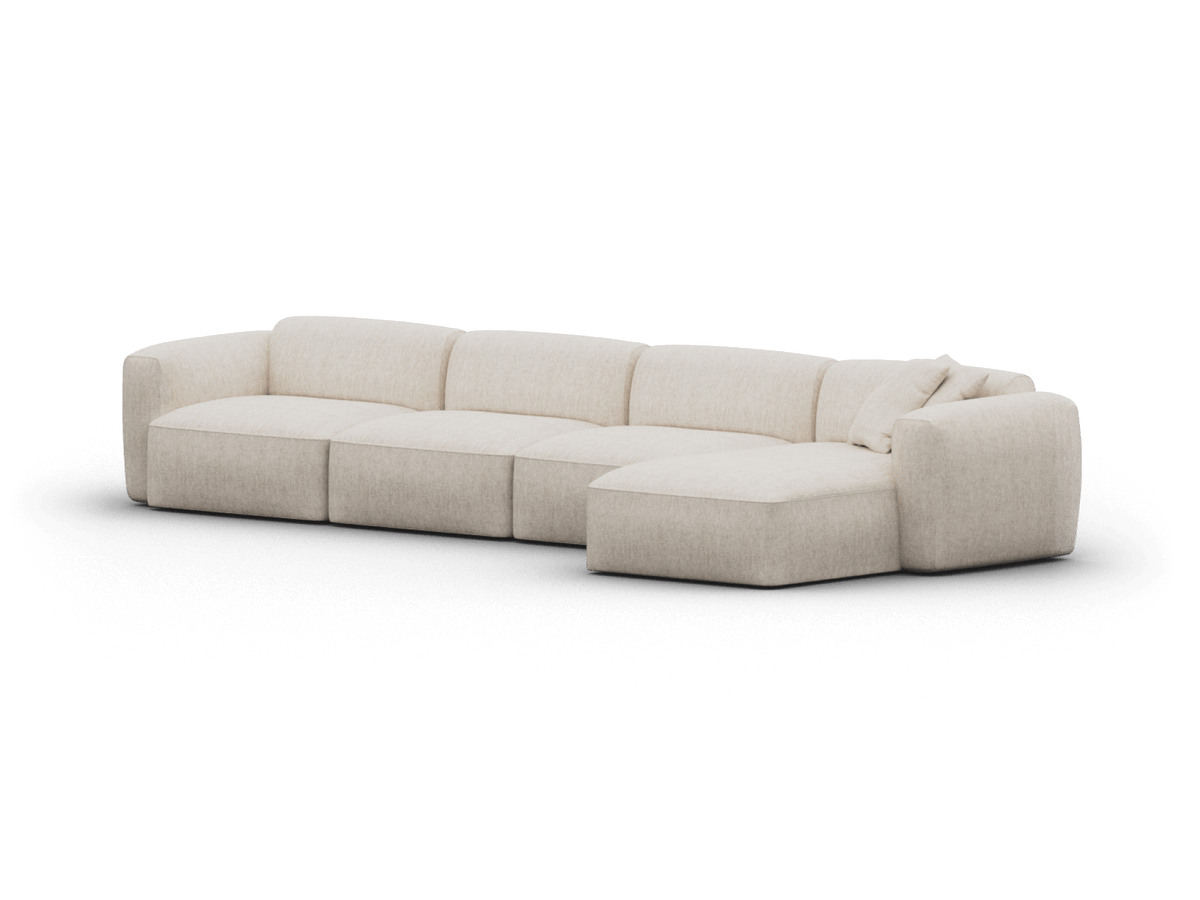 Modern sectional sofa, upholstered in cream linen, featuring plush cushions and a chaise lounge. Perfect for sophisticated, contemporary living spaces.