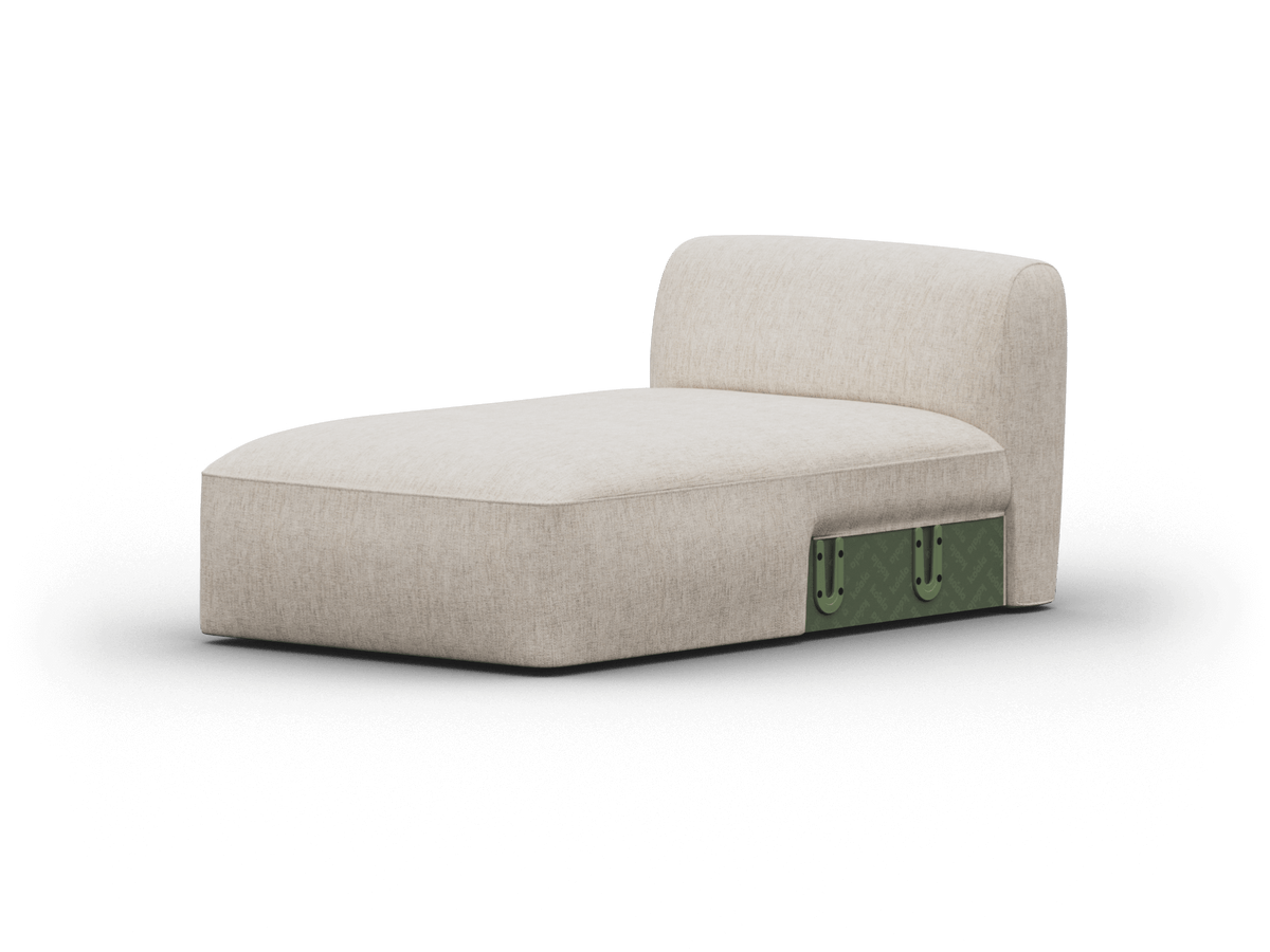 Modern beige chaise lounge with plush upholstery and green leather side accents, featuring a sleek armless design, ideal for contemporary living spaces.
