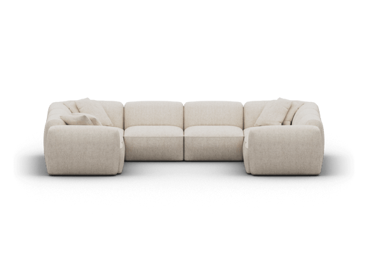 Luxurious modular sofa in plush beige fabric, featuring wide cushions and rounded edges. Set in a contemporary, minimalist living space.