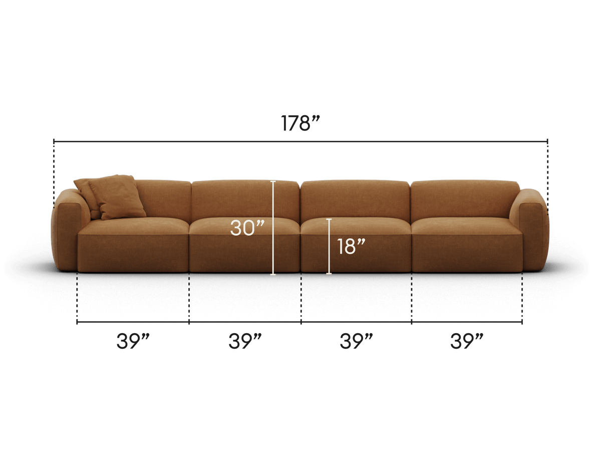 Luxurious brown sectional sofa, upholstered in soft fabric, featuring plush cushions and rounded armrests. Ideal for expansive, stylish living spaces.