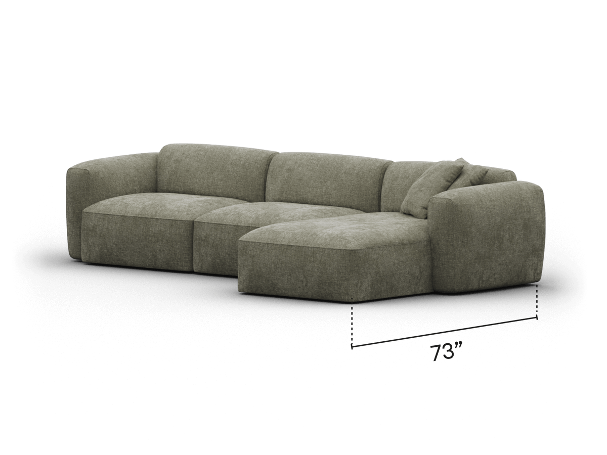 Modern grey fabric sectional sofa with plush cushions and armless chaise. Upholstered with premium texture. Ideal for spacious, sophisticated living areas.