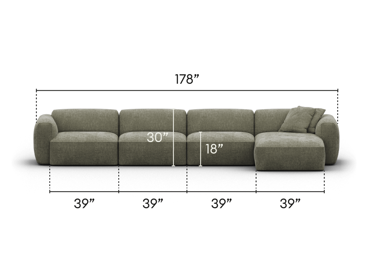 Luxurious modular sectional sofa, upholstered in premium grey fabric, featuring deep seating, plush cushions, and a sleek chaise. Ideal for a modern living room.