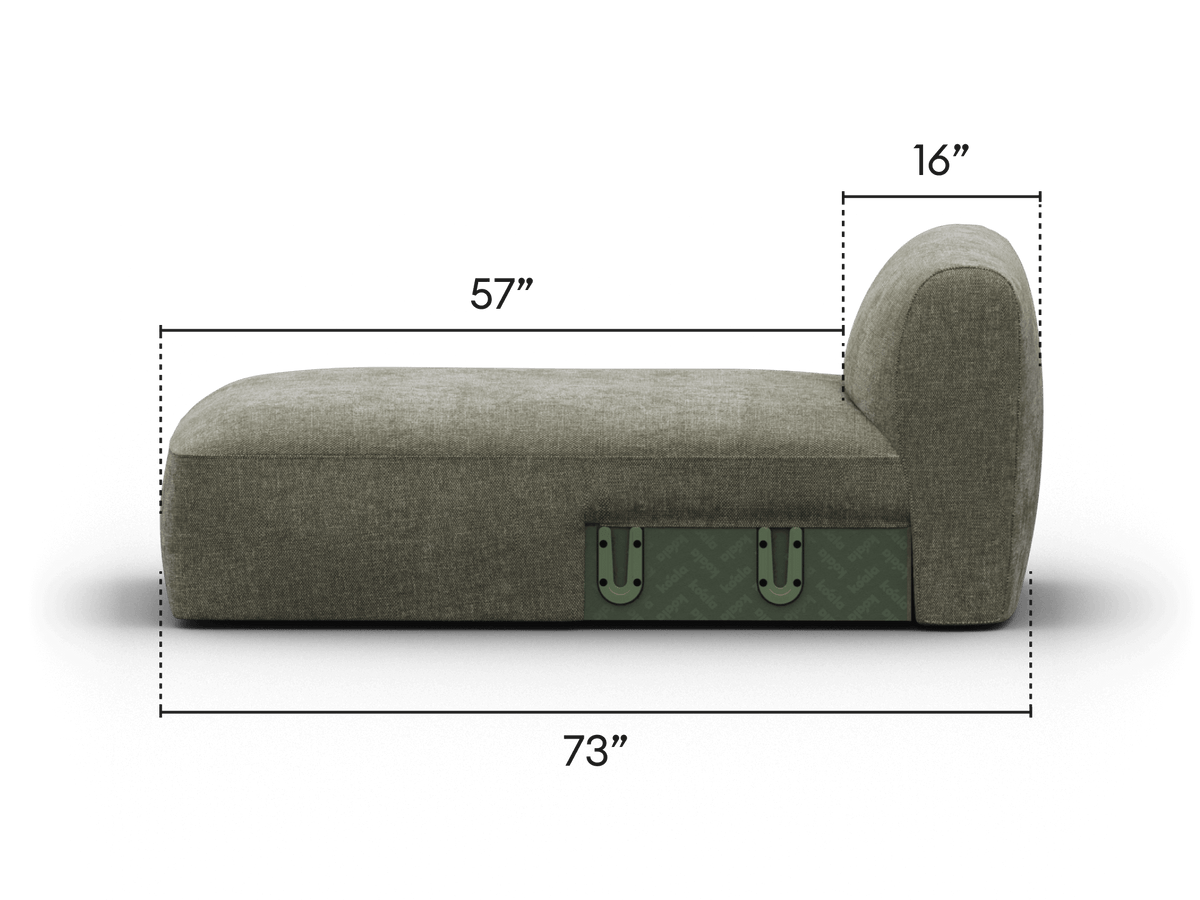 Elegant chaise lounge in textured grey fabric, featuring a sleek, rounded backrest and integrated green storage. Perfect for a sophisticated living space.