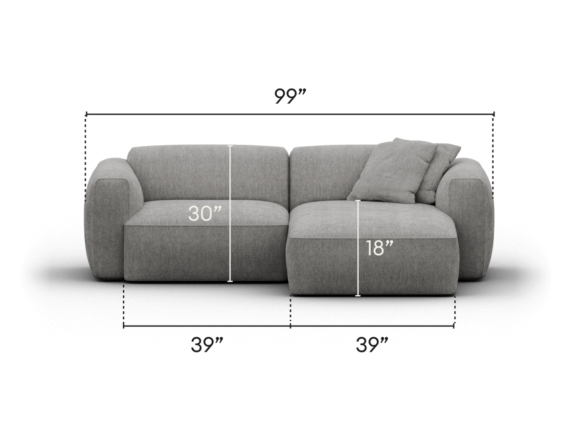 Luxurious grey fabric sectional sofa, featuring plush cushions and curved armrests. Chic, minimalist design perfect for modern living spaces.
