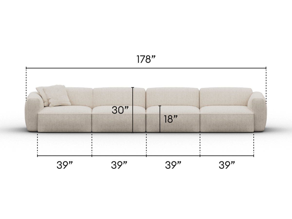 Luxurious cream modular sofa featuring plush upholstery, deep seating, and pillow embellishments. Perfect for spacious, contemporary living rooms.