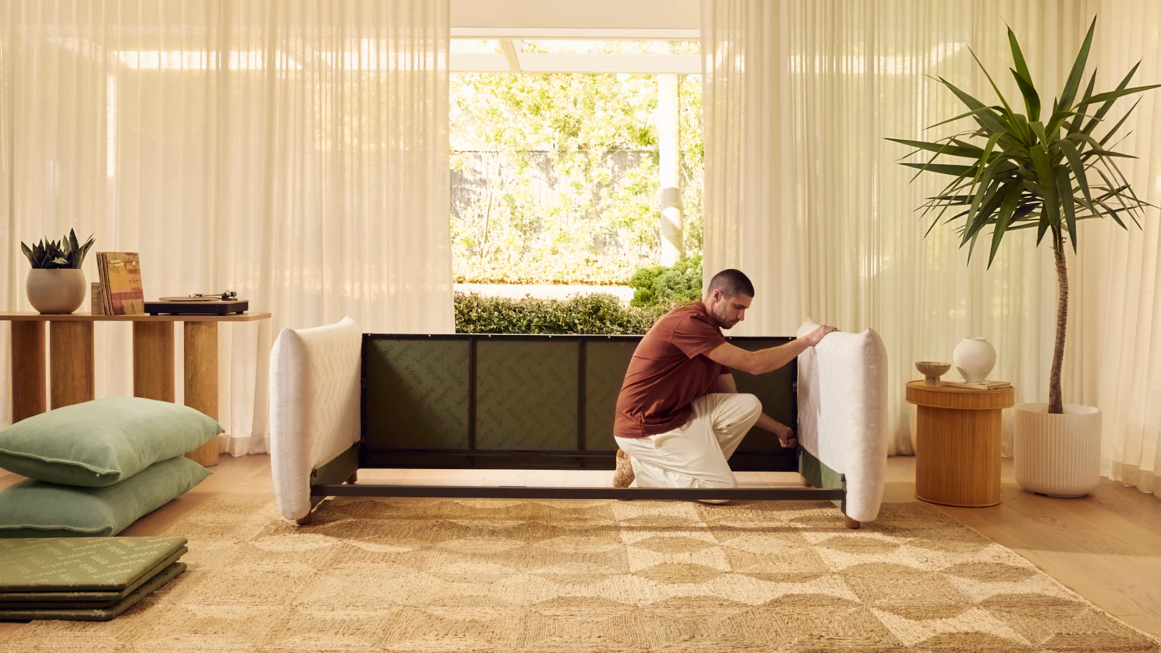 a person easily putting together a sofa bed