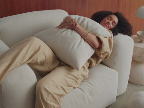 a comfortable light gray sofa in a modern living room, a stack of different colored pillows highlighting the exclusive color range, and a beautiful olive green sofa in a living room with oak floors