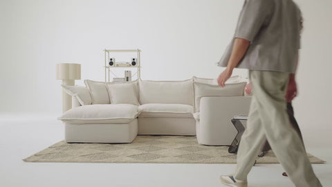 people sitting on comfortable sofa and putting it together in bright room