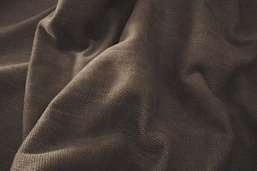 close up of dark brown fabric in sunny room