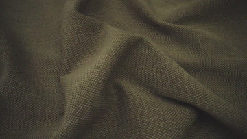 dark green fabric up close to show its texture
