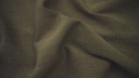 dark green fabric up close to show its texture
